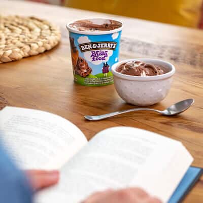 Pint of Half Baked with a bowl full and someone reading a book